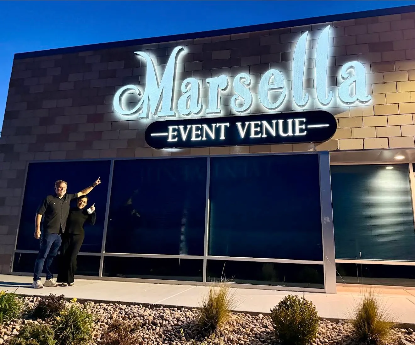 Marsella Event Venue at night, with its lit sign above the windows